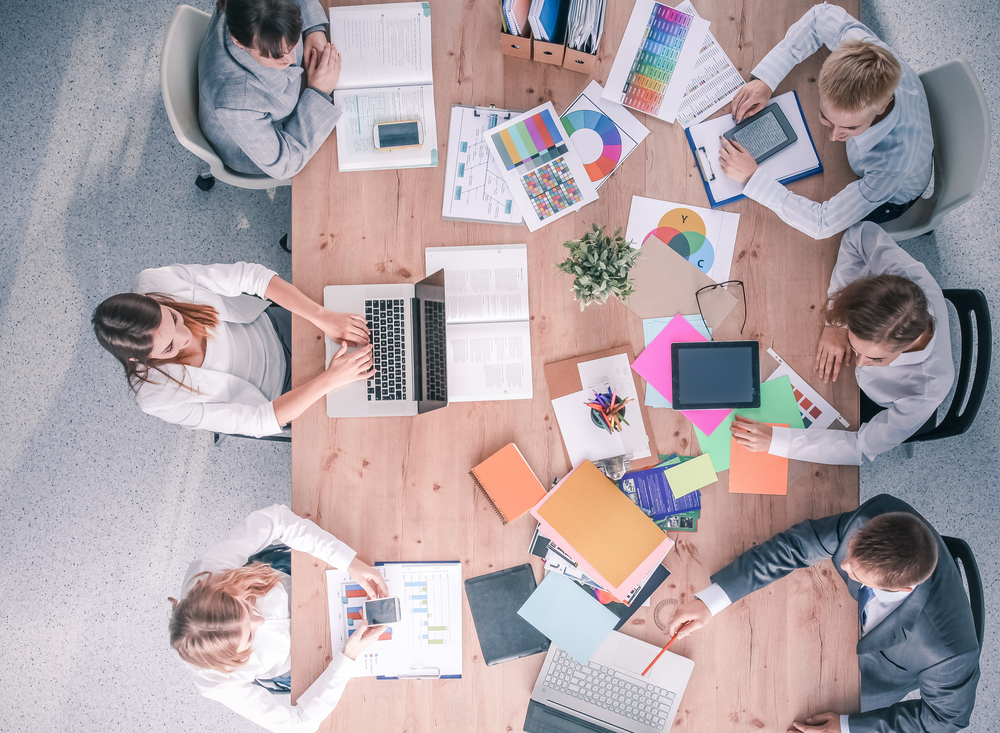 Business,People,Sitting,And,Discussing,At,Business,Meeting,,In,Office